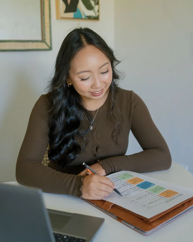 A student studies printed material at home.